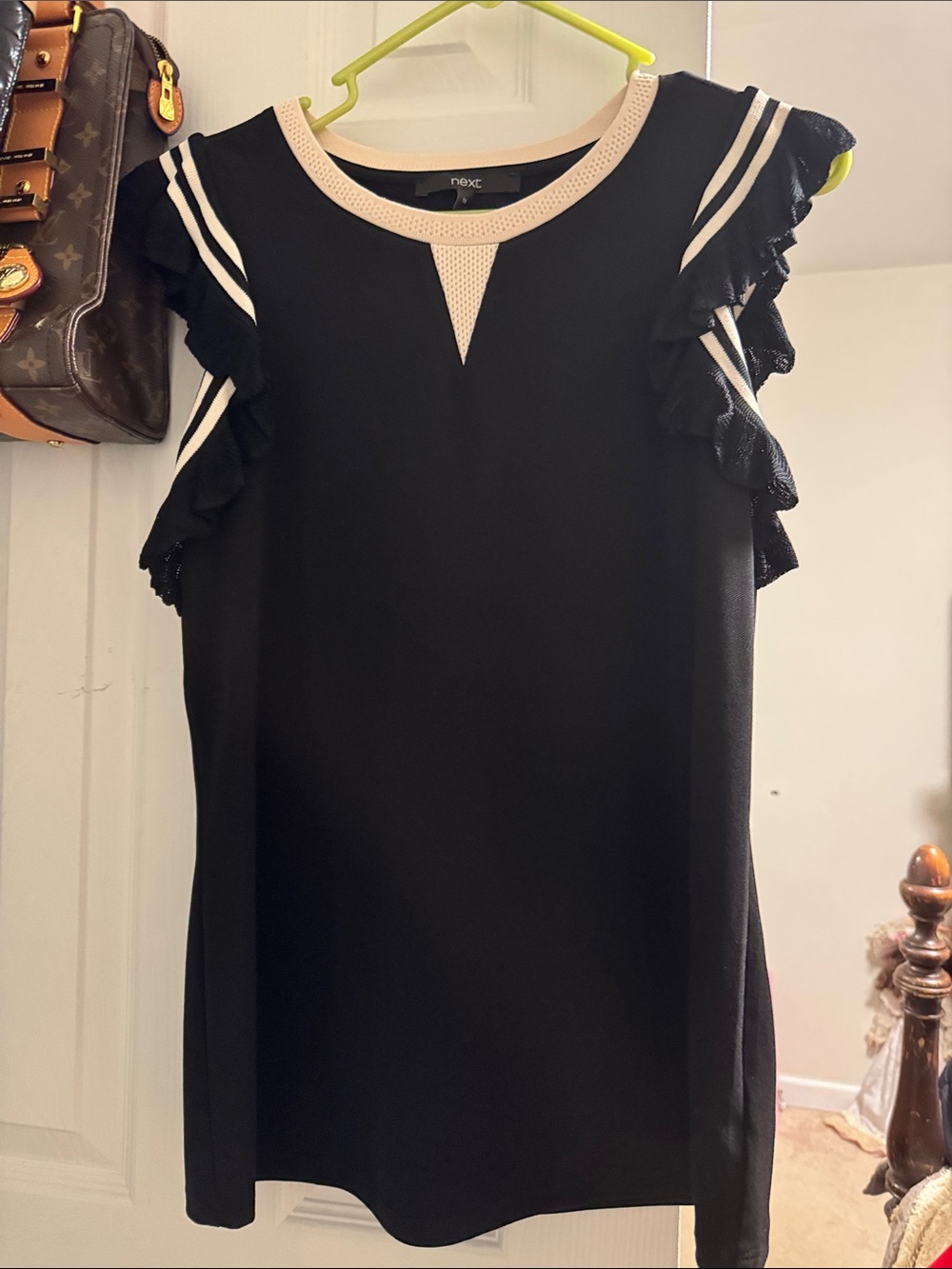 next Black Sleeveless Ruffle Trim Tunic with Cream Contrast Neck